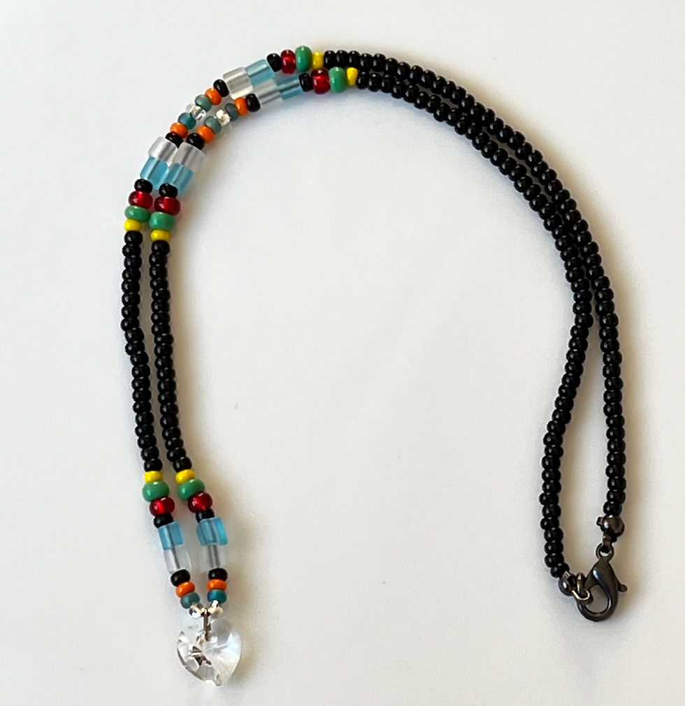 Thumbnail: Crystal heart on black and multi coloured glass bead chain necklace