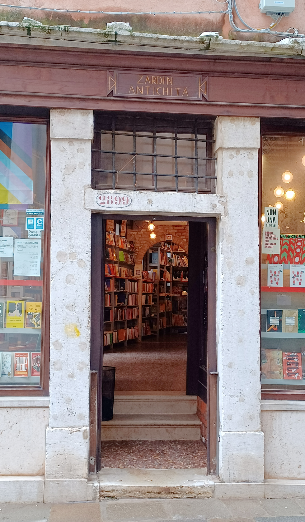 Bookshop door leading up three steps into a room of books