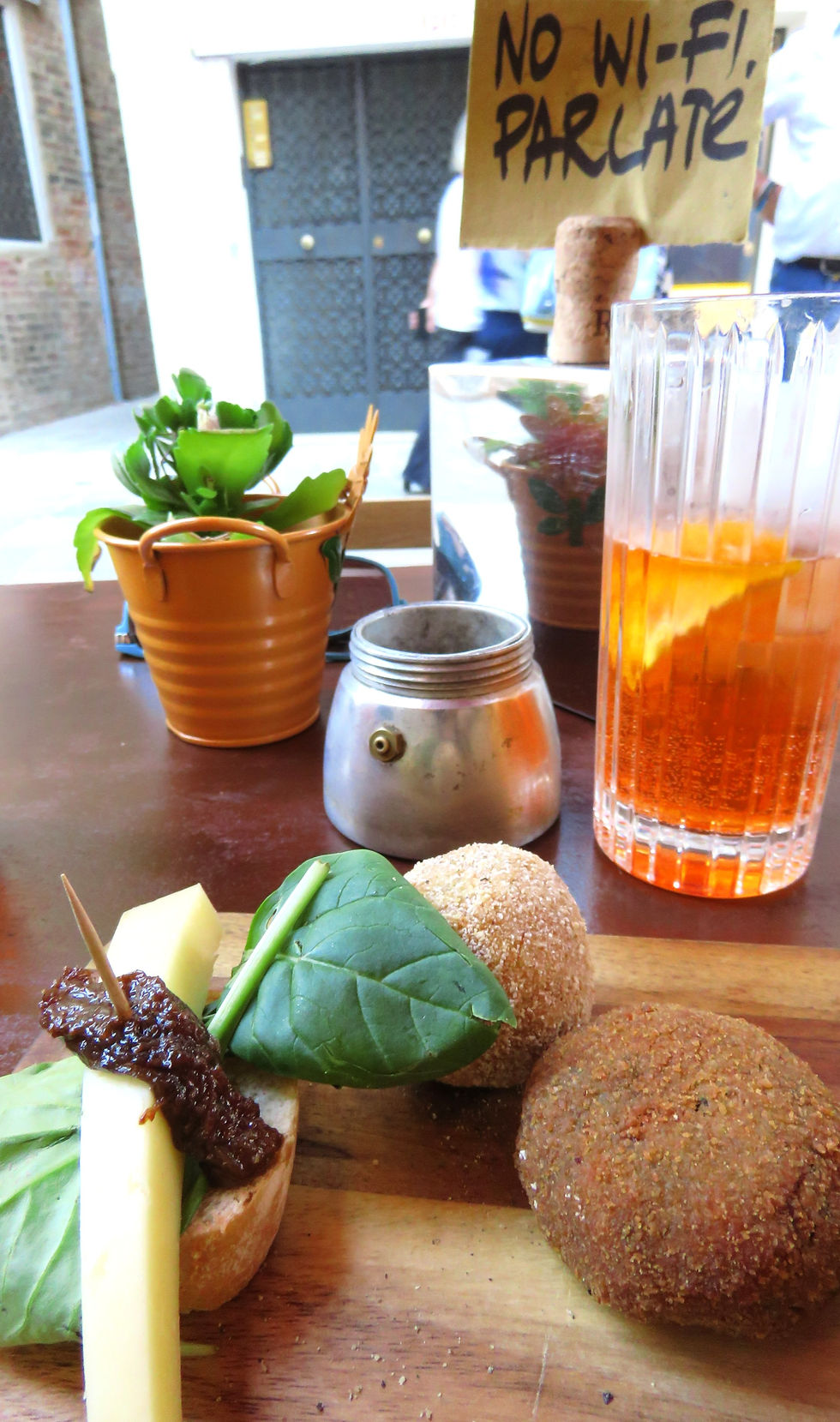 Cicheti in venice - meatballs and aperol spritz on a table