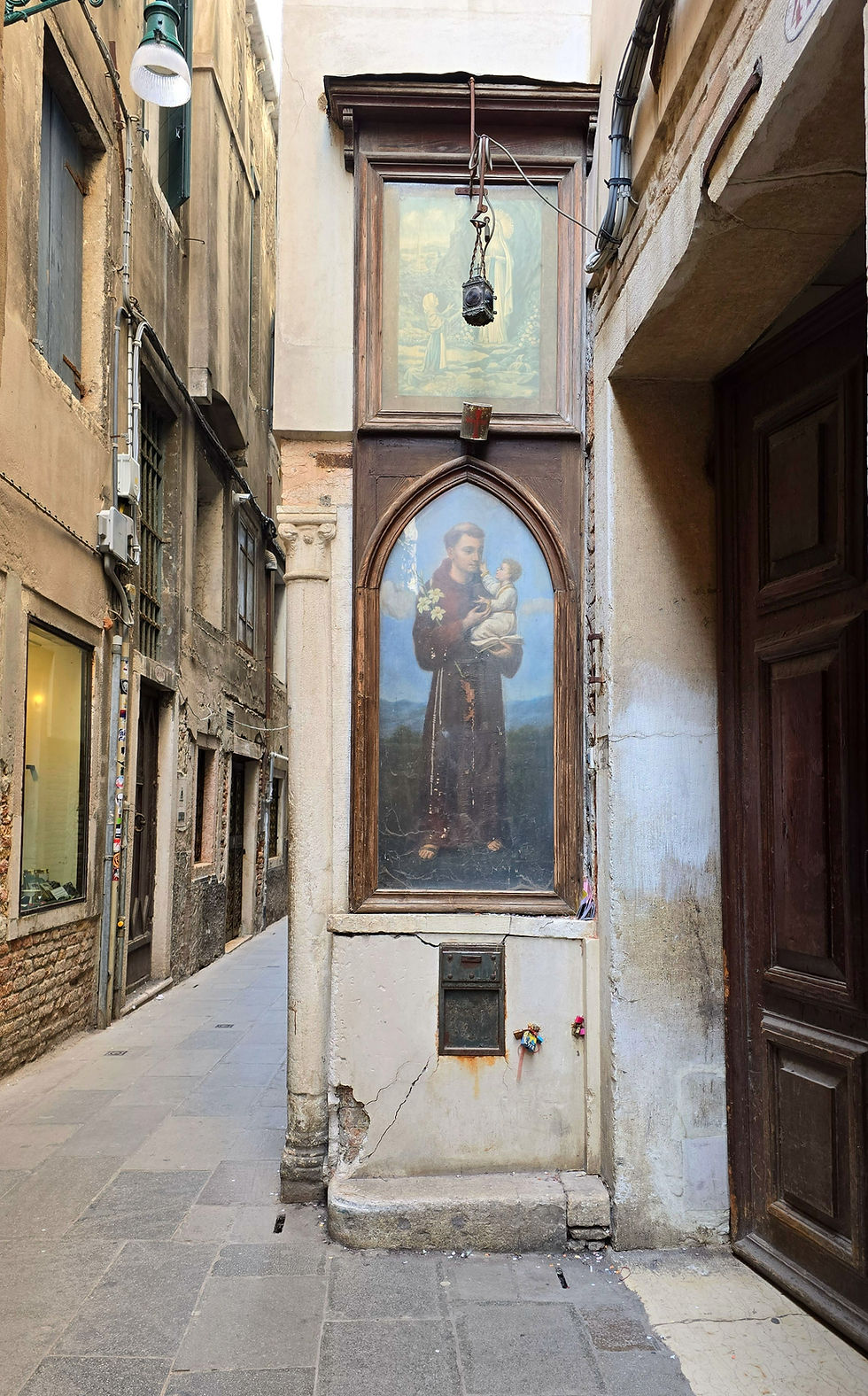 Religious art on a side wall in a venetian calle