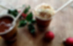 Italian hot chocolate in two cups with whipped cream on a Christmas table