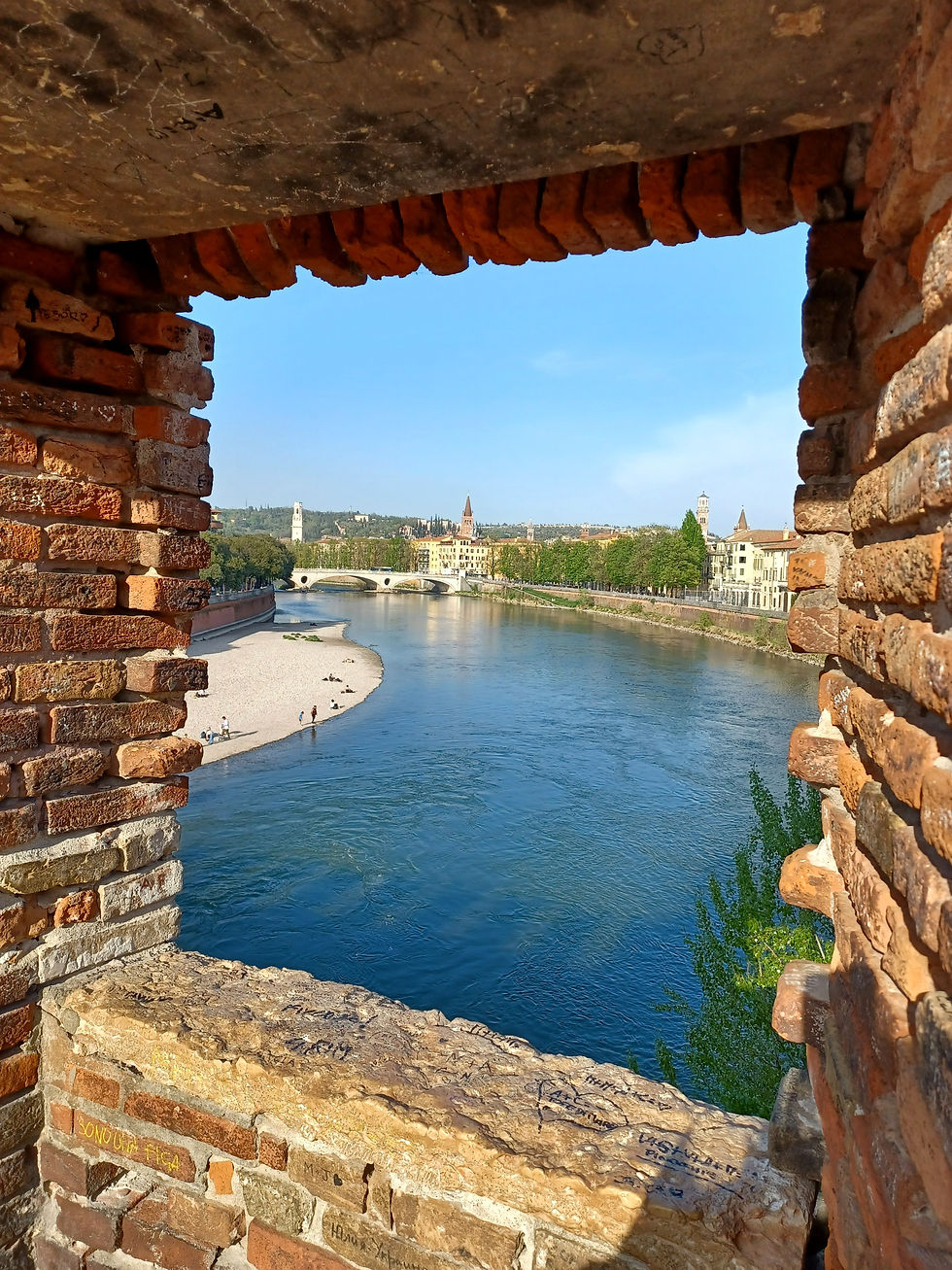 The city of Verona framed from a window in the Castel Vecchio Bridge