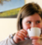 Little girl drinking Italian hot chocolate and smiling