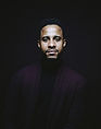A portrait of Angel Acosta looking at the camera.