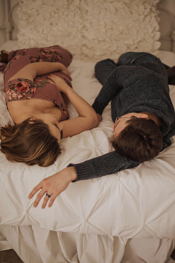 Family maternity photo lying in bed together, Hampton Roads photographer