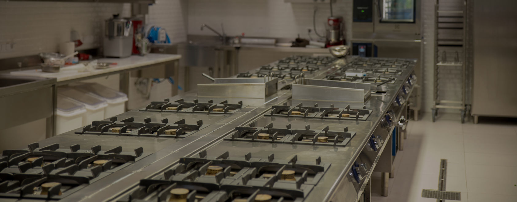 Commercial kitchen gas hobs and stainless steel benches