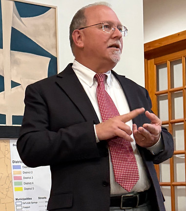 Brian McBroom speaking at an event.
