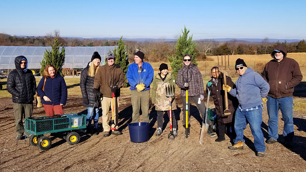 Farmer andy with work trade folks small.jpg