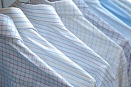 Hanging Shirts depicting Sunset Laundry laundromat in Methuen MA