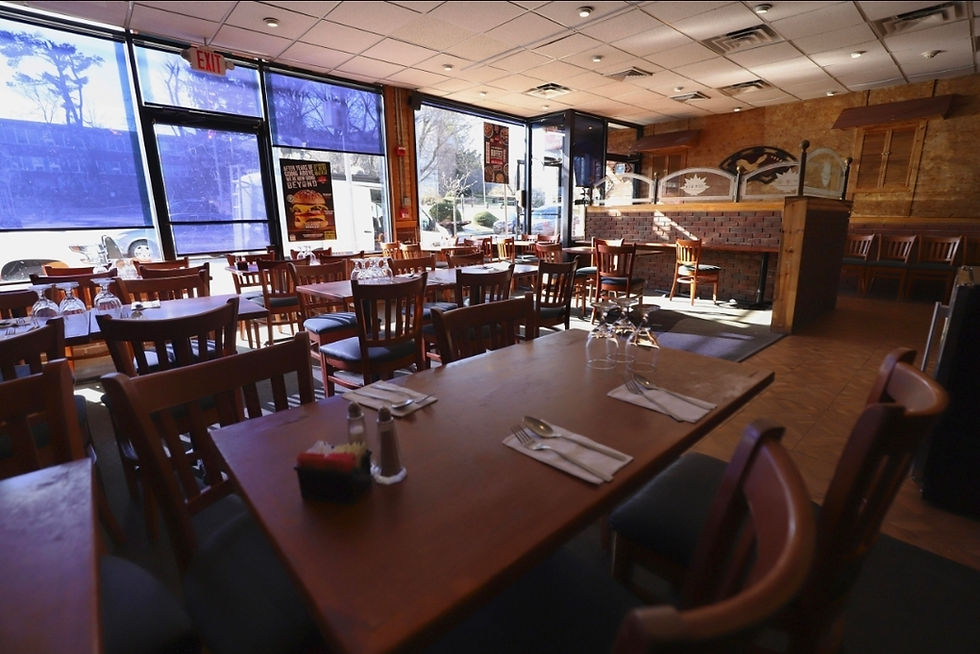 Empty casual dining restaurant interior highlighting reduced customer traffic and mid-market business pressure.