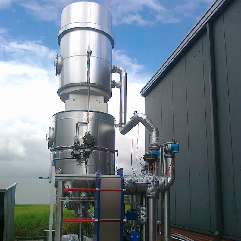 Industrial stainless steel distillation column outdoors