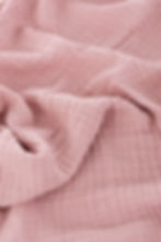 Pink muslin poncho fabric view.