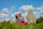 Prune Harris sitting by some sacred stones holding energy points