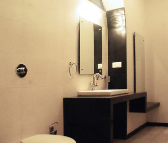 Modern bathroom with vanity area in Classic Room at Hotel Rajdeep Mount Abu.