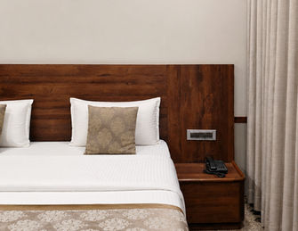 Comfortable deluxe room with king bed at Hotel Rajdeep Mount Abu.