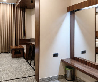 Dressing and storage area inside Super Deluxe Room at Hotel Rajdeep Mount Abu.