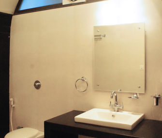 Classic Room bathroom featuring arched architectural details at Hotel Rajdeep Mount Abu.