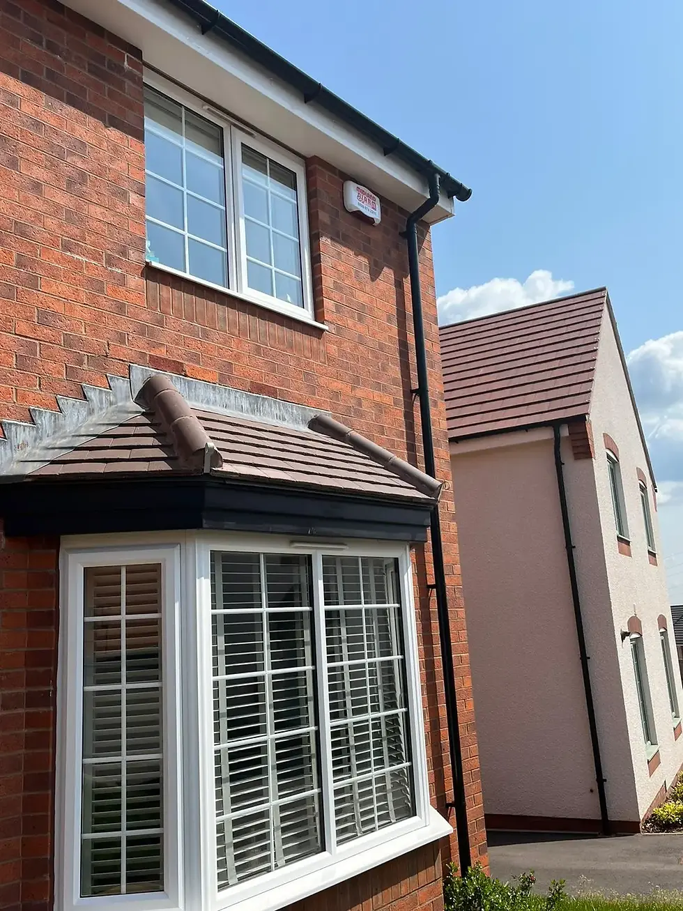 Home with burglar alarm installed in Coventry with visible bell box and remote monitoring