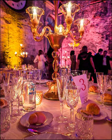 Elegant event table with golden candelabra, wine glasses, and table 3.