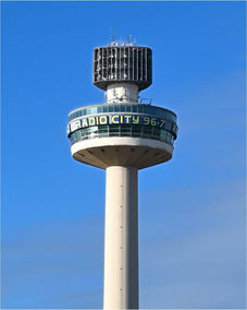 Radio City Tower, showing 'RADIO CITY 96.7' against clear blue sky.