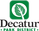 Decatur Park District logo featuring a stylized green leaf inside a white circle on a green square background above bold blac