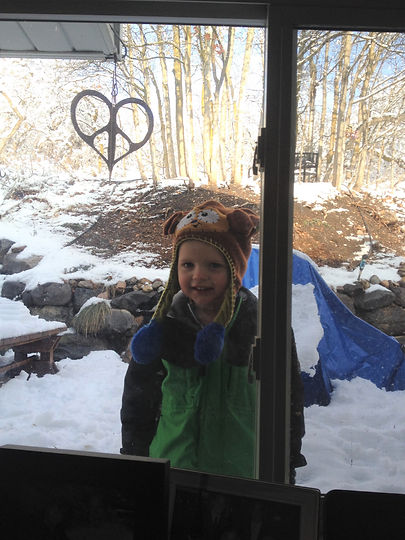 boy playing in the snow