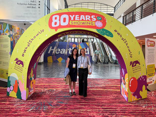 Whitney and Olivia standing below an arch at the 2026 School Nutrition Association Annual National Conference