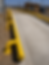 Yellow safety bollards by Mac Jay Steelworks atop a ramp.