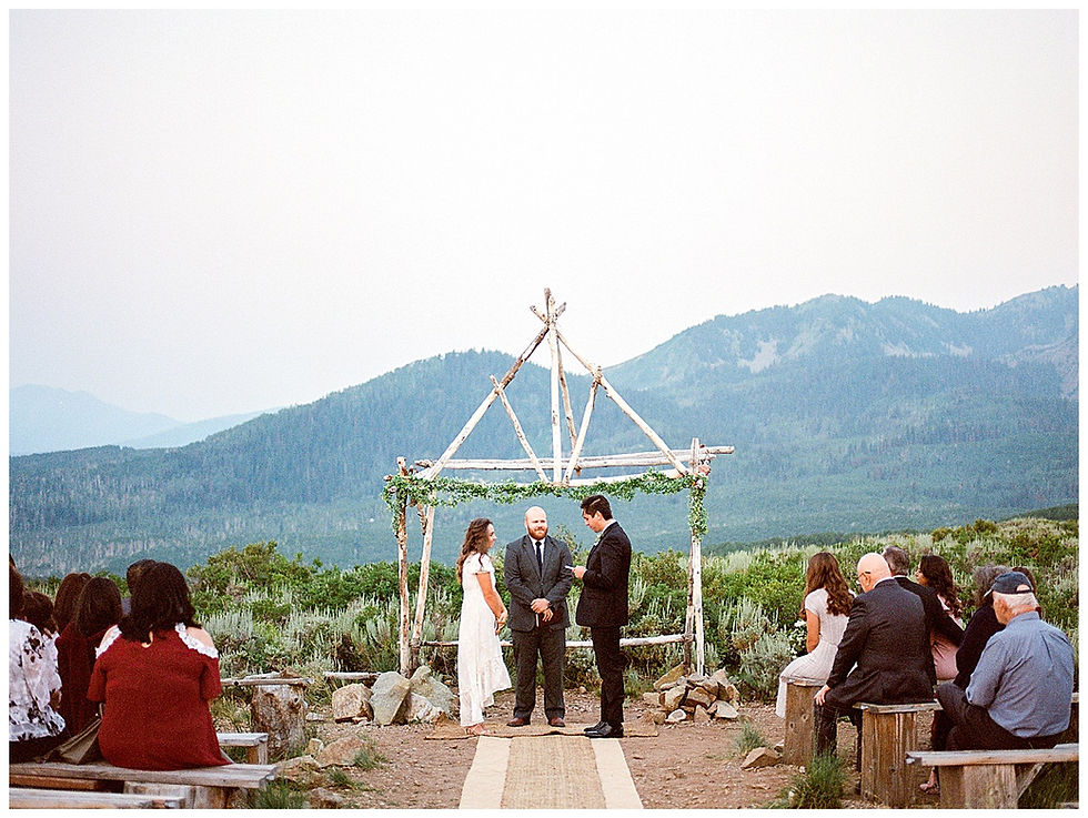 groom reading wedding vows to bride