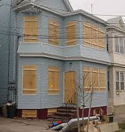boaded windows on a property preservation house