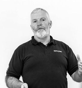 Black and white image of INFRATEC Training trainer delivering confined space and safety training in the UK