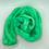 Thumbnail: Overview of one open hank of hand dyed mohair silk lace weight yarn in bright mint green.