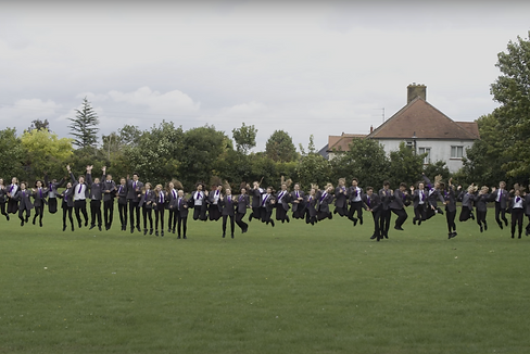 Bright Schools: Large group of secondary pupils jumping together excitedly.
