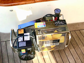 Scuba diving, cruising yacht, dive compressor, onboard compressor, Bauer Junior II, Coltri MCH-6, Mantus compressor, remote diving, unlimited air, boat maintenance, power consumption, inverter startup, petrol compressor, noise issues, tank refills, Caribbean diving, self-sufficient diving, compressor maintenance, breathing air safety, CO analyzer, diving freedom, anchorage diving, sustainable cruising, marine adventure