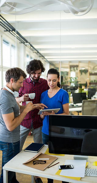 group-graphics-designers-using-digital-tablet-while-having-coffee.jpg