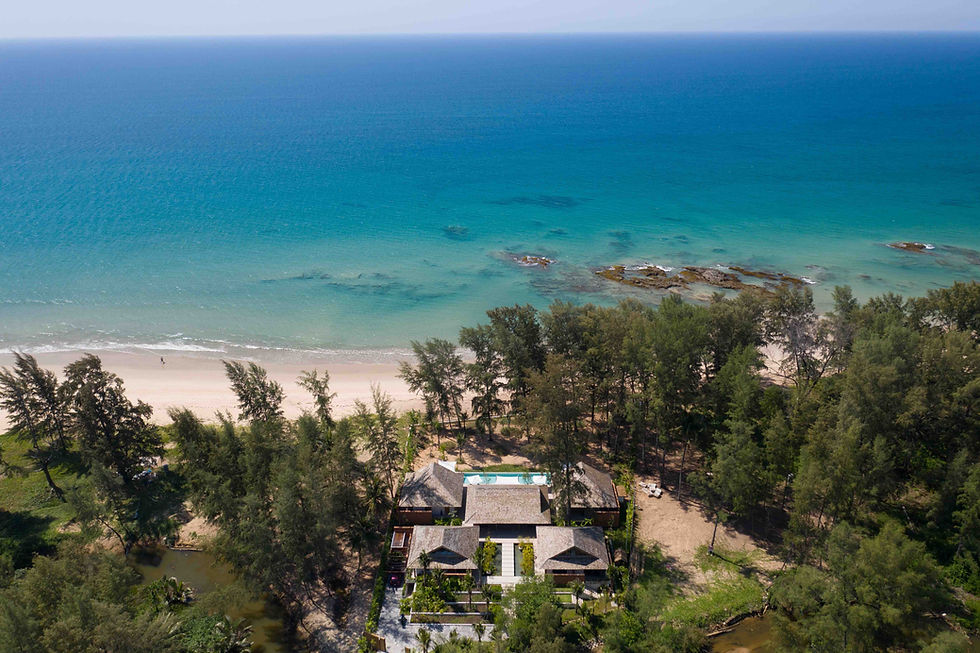 Exclusive oceanfront property with crystal-clear sea, surrounded by native trees and white sand beac