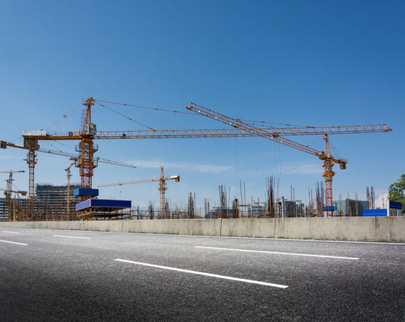 construction-site-with-cranes-against-blue-sky copy Large.jpeg