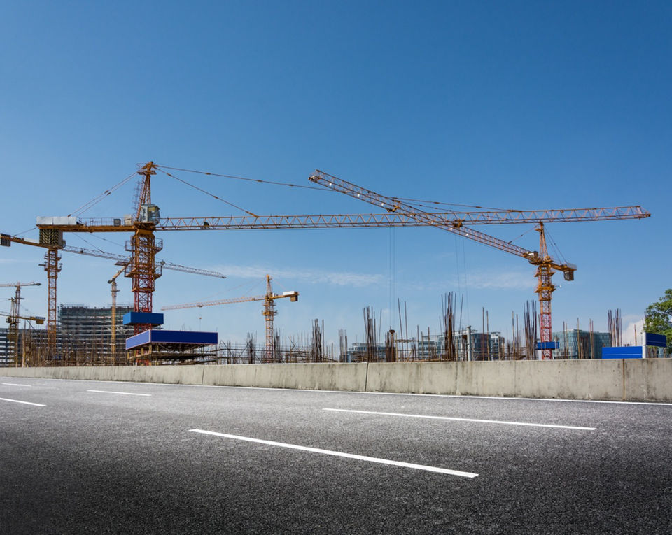 construction-site-with-cranes-against-blue-sky copy Large.jpeg