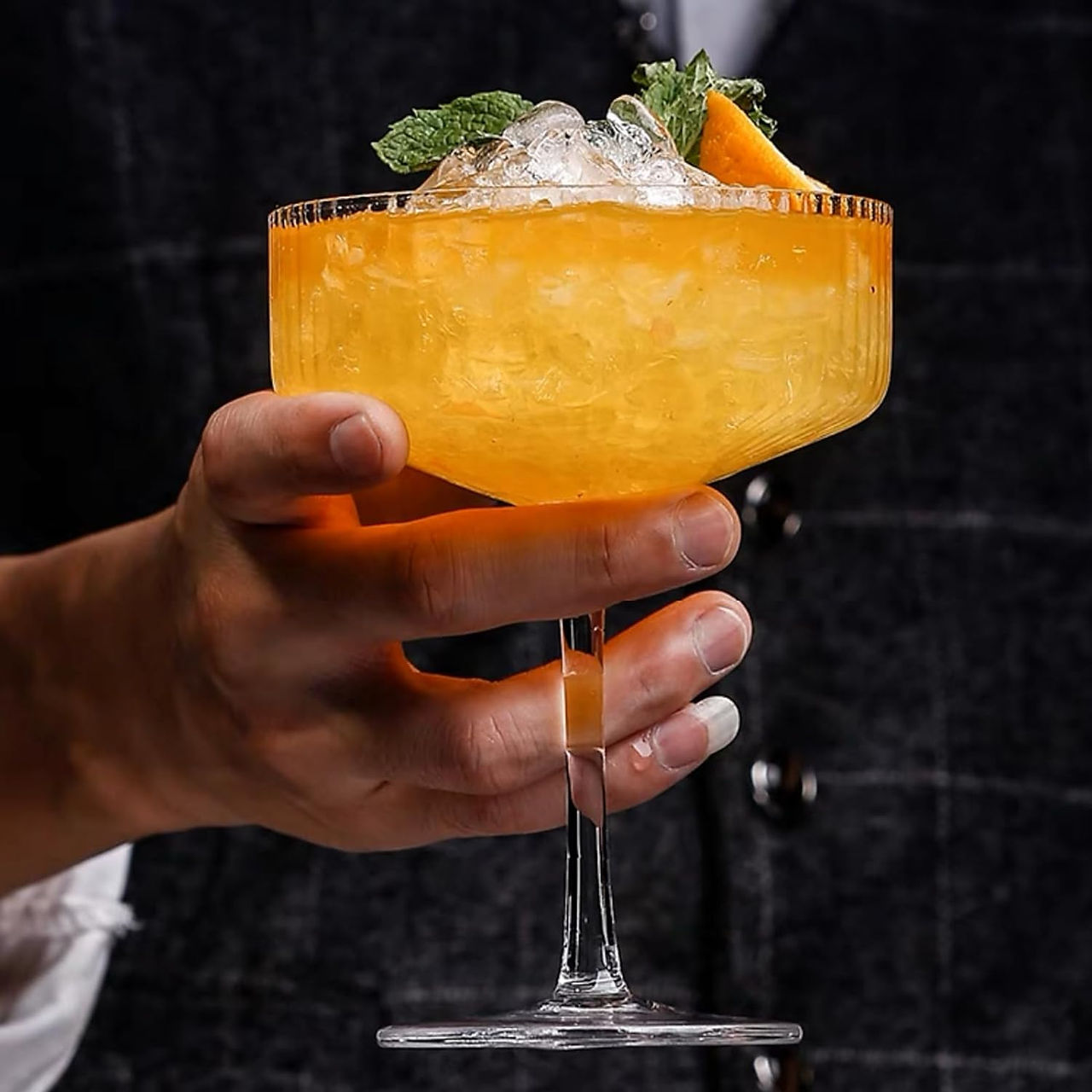 hand holding full cocktail