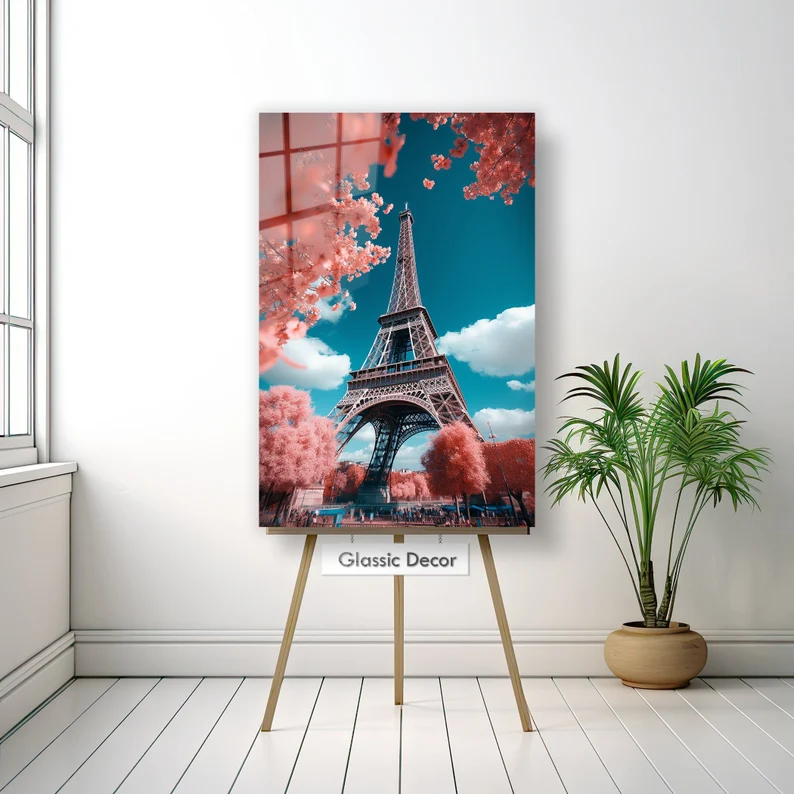 easel holding up teal and pink Eiffel Tower artwork