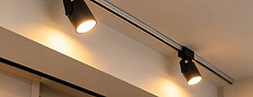 Spotlights emitting a warm glow are installed on the ceiling of Charm Pole Dance Studio.