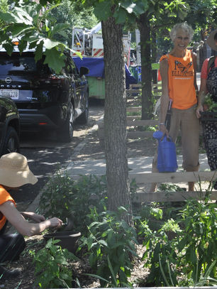Volunteers Natasha, Stephanie and Anne planting and watering tree bed. Photo by Lisa Ising.