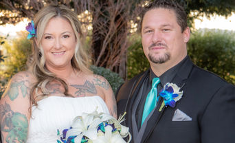 bride and groom under tree