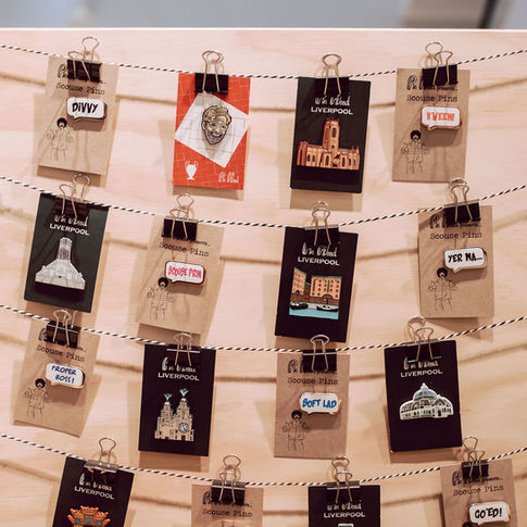Curated Makers Pop-Up display of Pin Head's Liverpool themed badges.