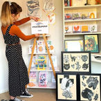 A Maker working on her homemade market stall display.