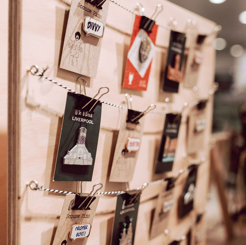 Curated Makers Pop-Up display of Pin Head's Liverpool themed badges.