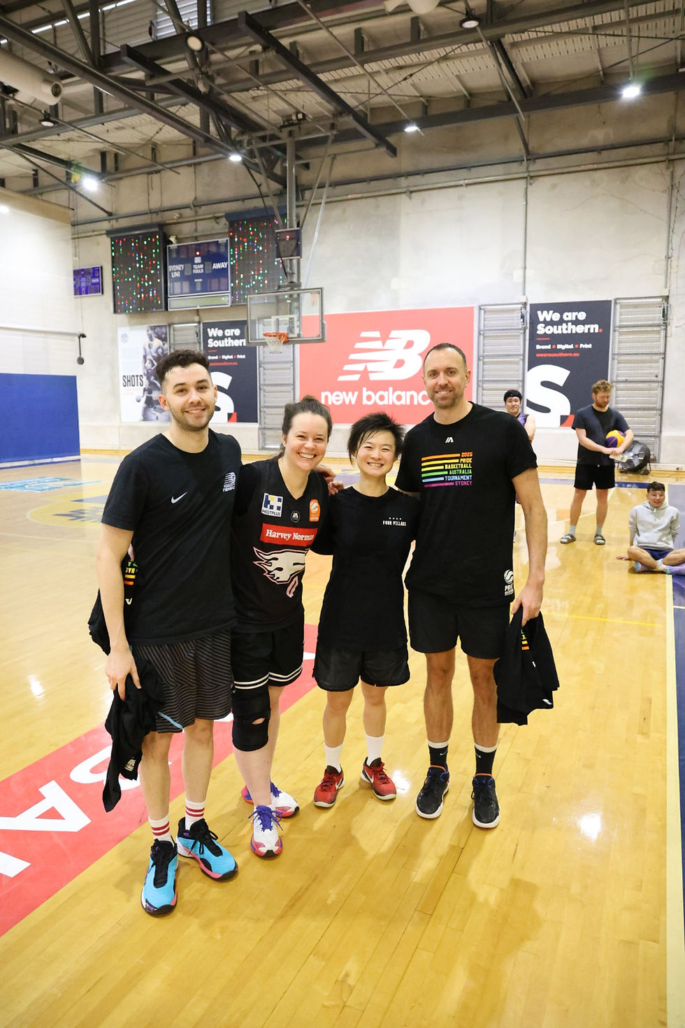 A mixed team poses for a photo