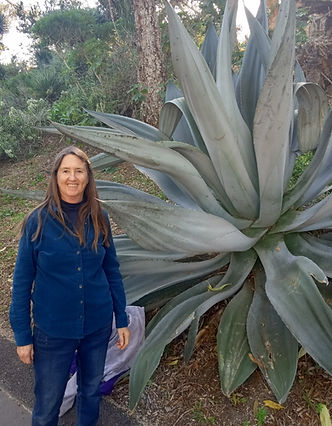 headshot with giant plant.jpg