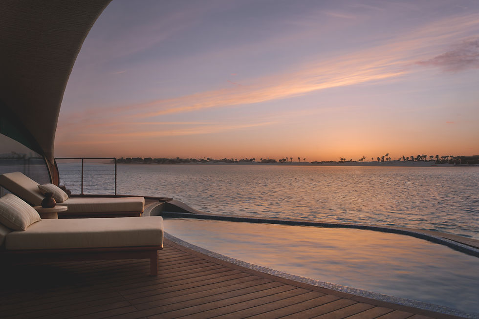 Nujuma, a Ritz-Carlton Reserve accommodation room type water villa sun deck pool with sunset view