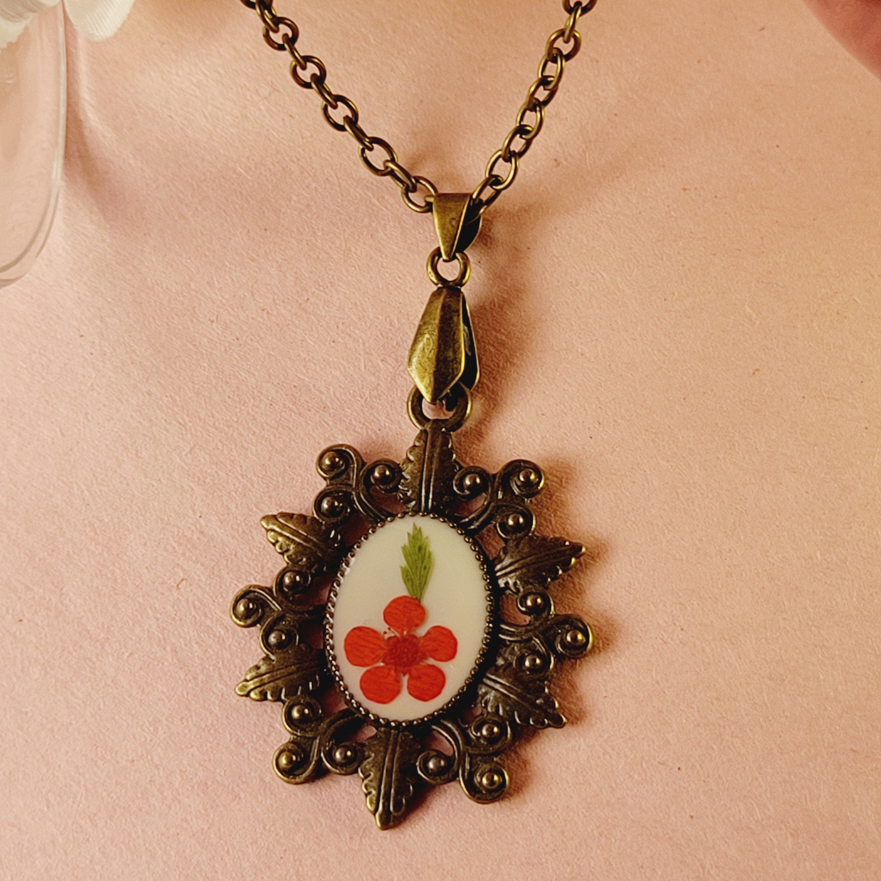 Plum flower on White Antique Oval Pendant | Refined Bloom-Inspired Pendant